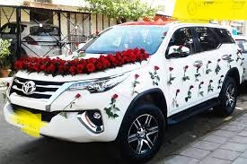 Toyota Fortuner cab for rent with flower design