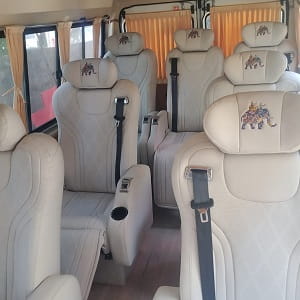 8 seater luxury tempo traveller rentals in bangalore price per km